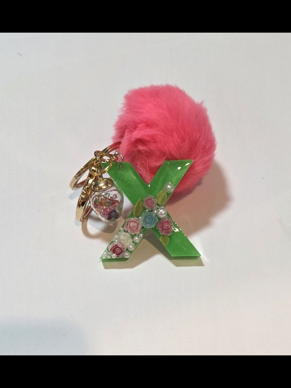 Green Resin 'X' Keychain with Floating flowers, Pink Pom & Glass Confetti Charm
